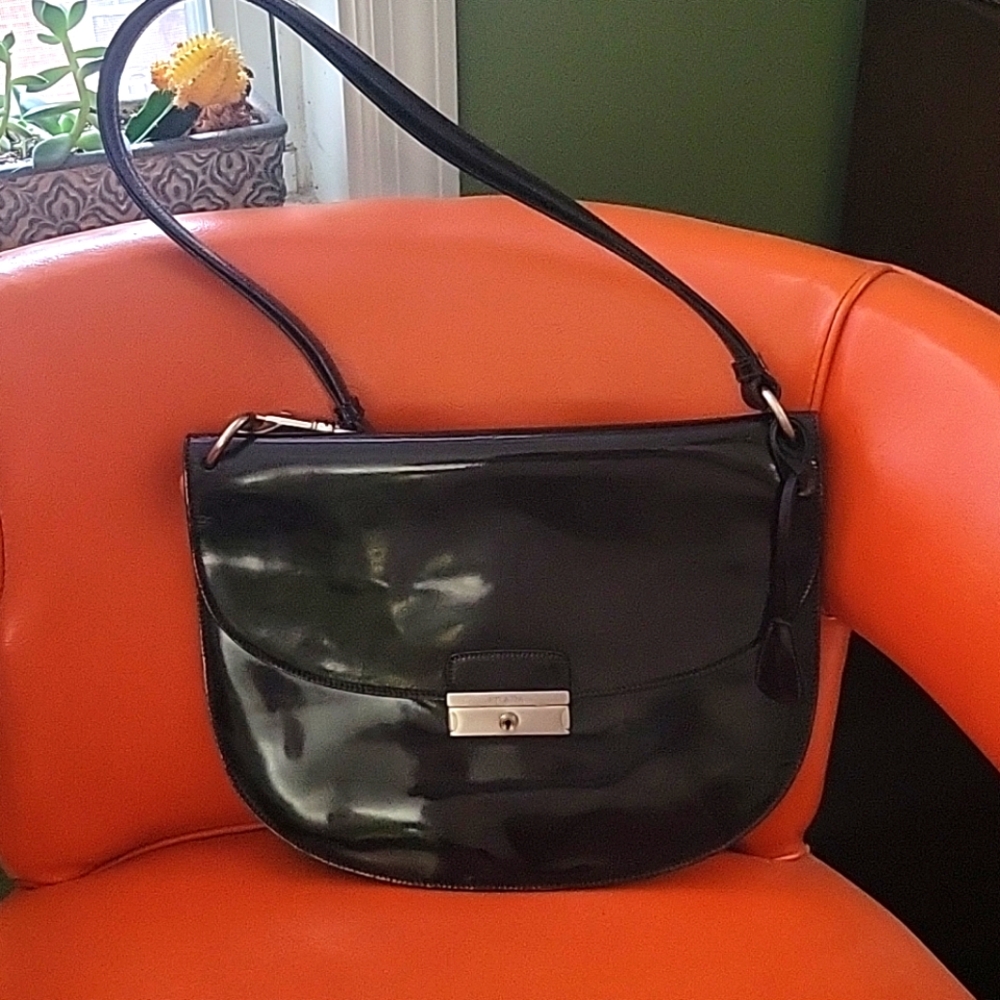 A patent leather Prada bag.